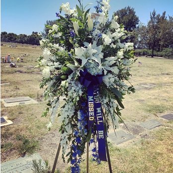 D'Lily's Flower - Blue and white funeral spray to honor my uncle at his service. - Florists Near Me - Watsonville, California D'Lily's Flower - Blue and white funeral spray to honor my uncle at his service. - Florists Near Me - Watsonville, California