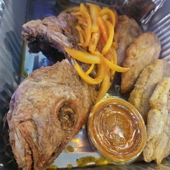 Belle Cuisine Caribbean Restaurant - Fish dinner, and it came with (not pictured) rice, salad,and  pikliz - Soul Food Near Me - Fort Lauderdale, Florida