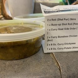 Ali's Roti Restaurant - Curry chickpeas in what they call and 8oz containers.