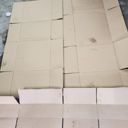 Clean cardboard to begin test for leaking oil.
