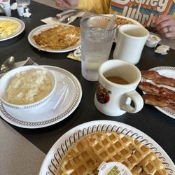Waffle House - Grits, bacon, hash browns, scrambled eggs, and pecan waffles.