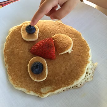 Orchids - Daughters smiley face pancakes. - Breakfast & Brunch Near Me - Honolulu, Hawaii