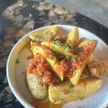 Red Herring Restaurant & Bar - Crispy potatoes appetizer - Bars Near Me - Waco, Texas Red Herring Restaurant & Bar - Crispy potatoes appetizer - Bars Near Me - Waco, Texas