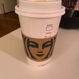 a coffee cup with a face on it a coffee cup with a face on it