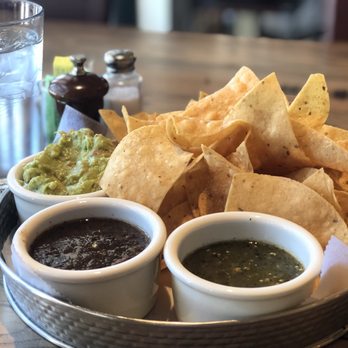 Ghost Ranch - Guacamole, roasted red salsa, roasted green salsa tomatillos style with fresh chips. BooM - Cocktail Bars Near Me - Tempe, Arizona Ghost Ranch - Guacamole, roasted red salsa, roasted green salsa tomatillos style with fresh chips. BooM - Cocktail Bars Near Me - Tempe, Arizona