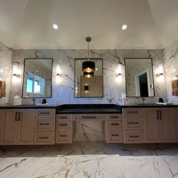 Primary bath with porcelain slab walls. Primary bath with porcelain slab walls.