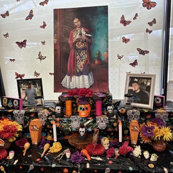 Delicias Cafe - A shrine for Day of the Dead. The young man in the picture on the right, died at age 29. - Mexican Near Me - Albuquerque, New Mexico