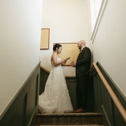 The Richland - An intimate, documentary-style portrait focusing on the couple's connection, framed perfectly along the staircase, sharing private vows.