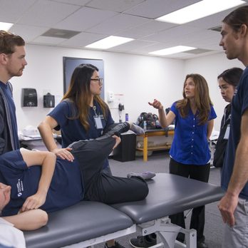 Stanbridge University - Physical Therapist Assistant students train and practice proper techniques. - Colleges & Universities Near Me - Irvine, California Stanbridge University - Physical Therapist Assistant students train and practice proper techniques. - Colleges & Universities Near Me - Irvine, California