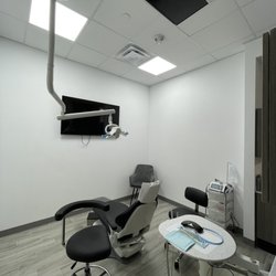Floss Dental- Pearland - Clean facility with tv on front wall and ceiling!