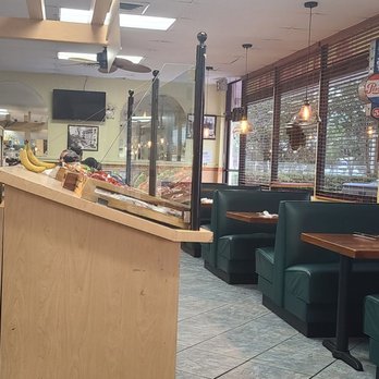 JJ Cafe - Side seating (there are tables behind the display case) - Cafes Near Me - Fort Lauderdale, Florida