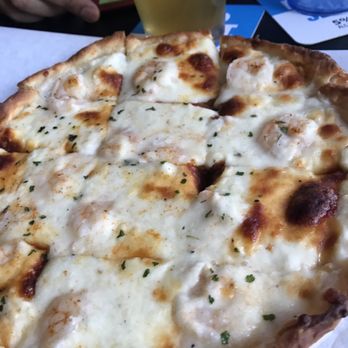 Jakes Pizza - a pizza with cheese and herbs - Pizza Near Me - Green Bay, Wisconsin