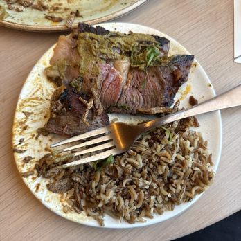 Owamni - Bison with green mole sauce and wild rice, topped with fried shallots - New American Near Me - Minneapolis, Minnesota Owamni - Bison with green mole sauce and wild rice, topped with fried shallots - New American Near Me - Minneapolis, Minnesota