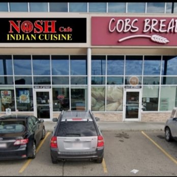 Nosh Cafe - cars parked in front of the restaurant - Indian Near Me - Edmonton, Alberta Nosh Cafe - cars parked in front of the restaurant - Indian Near Me - Edmonton, Alberta