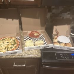 New York Pizza and Pints - My order. Supposed garlic knots, cheese bread, and a by pizza. This is trash.
