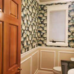 Cheryl von Tress Interiors + - Upgraded powder room with new wallpaper, wainscoting panels and painted cabinetry.