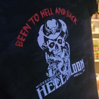Smitty’s Hell Saloon - a skull with a hat on - Burgers Near Me - Pinckney, Michigan