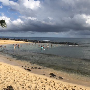 Poipu Beach - Kiddie pool to the left with enclosed lava rock wall. - Beaches Near Me - Koloa, Hawaii Poipu Beach - Kiddie pool to the left with enclosed lava rock wall. - Beaches Near Me - Koloa, Hawaii