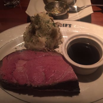 J. Alexander's - 16oz prime rib cooked a perfect medium, smashed potatoes and au jus. So good! - New American Near Me - Livonia, Michigan