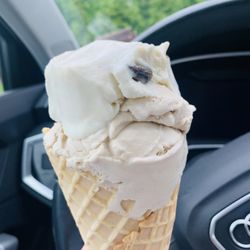 Grassroots Ice Cream - Pistachio and Rum and Coke on a waffle cone