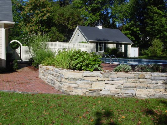 Retaining Walls - BC Landscaping offers expert retaining wall services designed to enhance the beauty, functionality, and stability of your landscape. Whether you need to prevent soil erosion, manage slopes, or create visually striking garden features, our team specializes in building durable and aesthetically pleasing retaining walls. Using top-quality materials like natural stone, brick, and concrete blocks, we tailor each project to your specific needs and vision. Our retaining walls not only add curb appeal but also help with drainage and landscape management. Trust BC Landscaping for reliable, long-lasting retaining walls that transform your outdoor space. Contact us today for a consultation.