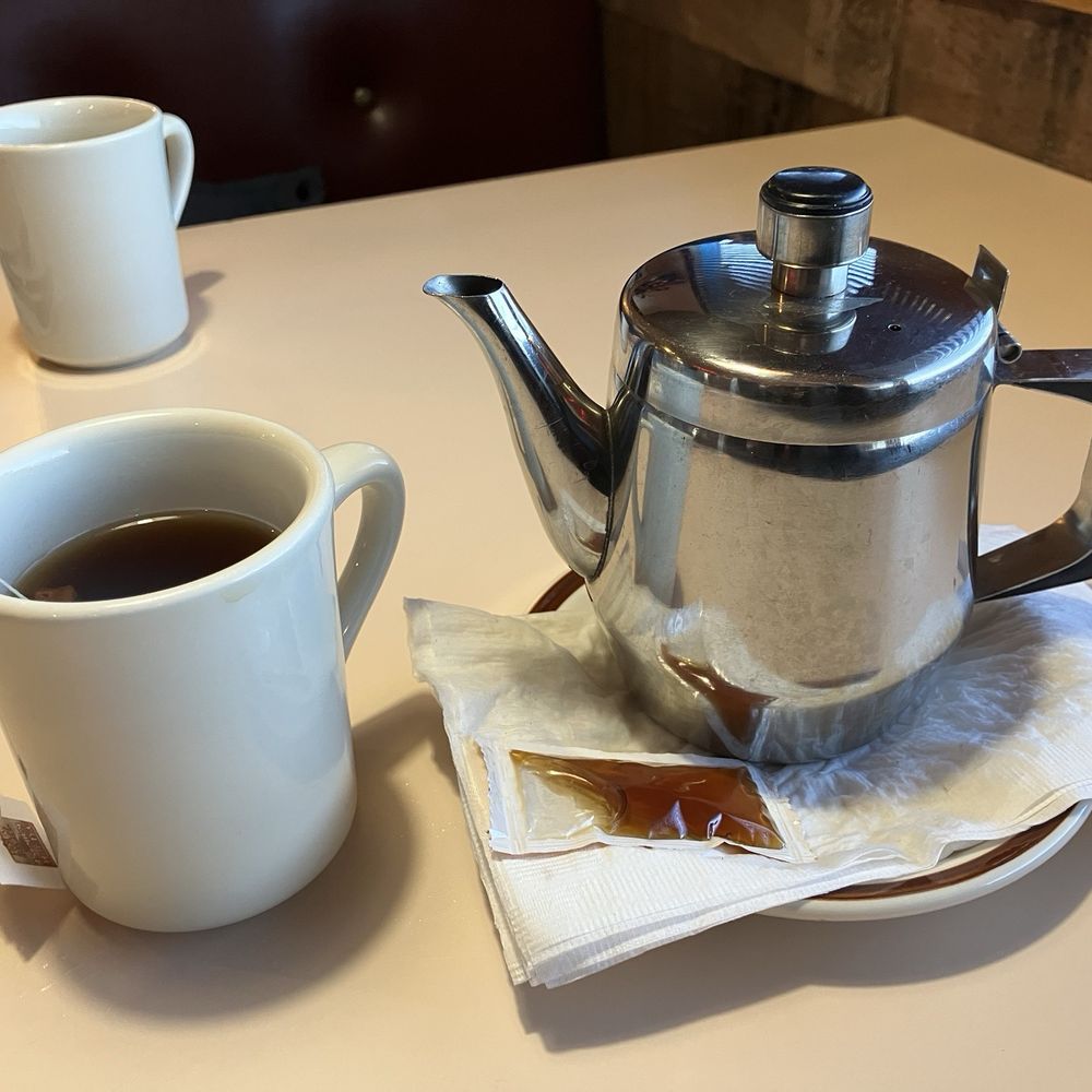 Olympian Restaurant - Hot tea! I loved the pot of hot water! Stayed hot the whole time!! Husband's coffee in the background. - Greek Near Me - Salt Lake City, Utah Olympian Restaurant - Hot tea! I loved the pot of hot water! Stayed hot the whole time!! Husband's coffee in the background. - Greek Near Me - Salt Lake City, Utah