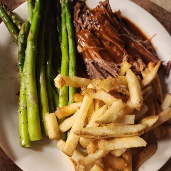 Ted's Montana Grill - My friend had bison with gravy, asparagus and fries. - American Near Me - Jacksonville, Florida