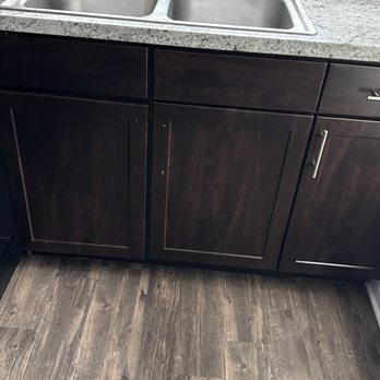 Bell Flatirons Apartments - Kitchen cabinets missing door handles - Apartments Near Me - Louisville, Colorado