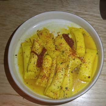 Lilia - Sheeps Milk Cheese Filled Agnolotti, Saffron, Dried Tomato, Honey - Italian Near Me - Brooklyn, New York Lilia - Sheeps Milk Cheese Filled Agnolotti, Saffron, Dried Tomato, Honey - Italian Near Me - Brooklyn, New York