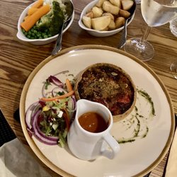 Cripple Creek Inn - Mediterranean tart with sauté potatoes, vegetables and tomato and basil sauce, with salad garnish. £15