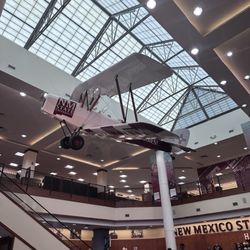 An airplane hangs overhead