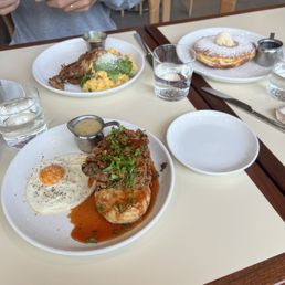 Chicken and Biscuit, Migas with pork carnitas, and the original paperboy pancake Chicken and Biscuit, Migas with pork carnitas, and the original paperboy pancake