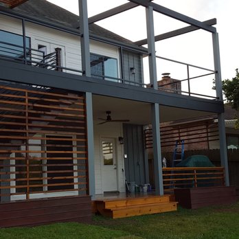 Chavez Construction - a house with a deck and a pergol roof - General Contractors Near Me - Rosenberg, Texas