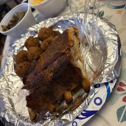 4 rib bones, hush puppies, green beans and Mac and cheese 4 rib bones, hush puppies, green beans and Mac and cheese