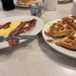 Belgium waffle with eggs and bacon.