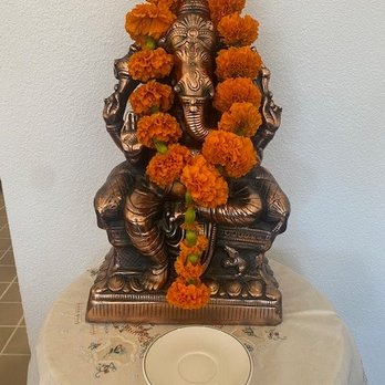 Penn's Thai House - Ganesh with flowers - Thai Near Me - Henderson, Nevada Penn's Thai House - Ganesh with flowers - Thai Near Me - Henderson, Nevada