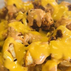 Chubby's Hot Chicken - A closer look of that glossy spicy nacho cheese sauce on the Chubby Fries.