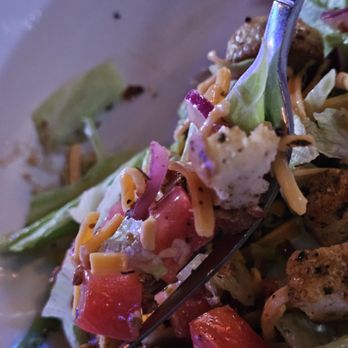 Sidewinders Steakhouse & Saloon - Aa fork with some of the house salad with balsamic vinaigrette dressing. - Bars Near Me - Roanoke, Virginia