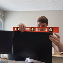 NGT Solutions - andy making sure the monitors are perfectly even