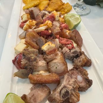 Faros Restaurant - Picalonga, a sampler platter consisting of pork belly, cheese, pork sausage, salami, and fried plantains - Dominican Near Me - Framingham, Massachusetts