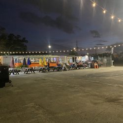 The GOAT Simply Delicious - The tipsy trolley and the outdoor seating with a large asphalt parking area no dust flying around!
