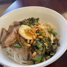 a bowl of noodles with meat and vegetables a bowl of noodles with meat and vegetables