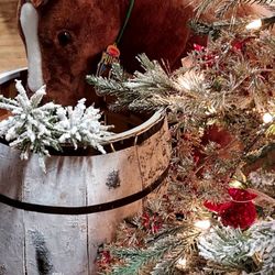 Robinson's Home & Garden & the Basket Loft - Stuffed miniature horse next to one of many beautifully decorated Christmas trees upstairs.
