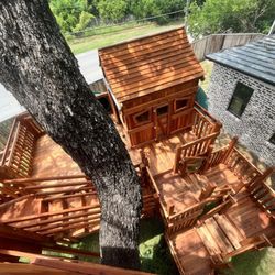 Backyard Fun Factory - Custom Tree House with cabins, multi-levels, stairs, swings and slides.