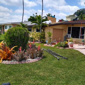 A&E Brothers Roofing - Installing plywood and insulation on trusses. Yard kept clear of debris. - Roofing Near Me - Miami, Florida