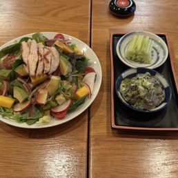Complementary salad and tako wasa Complementary salad and tako wasa