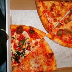 Baldwin Pizzeria - Margherita, cheese, chicken parm, and sausage slices.