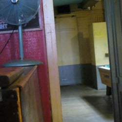 That little concrete partition behind the pool table is the men's room.