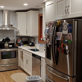 Cabinets To Go - a kitchen with stainless steel appliances - Kitchen & Bath Near Me - Beltsville, Maryland