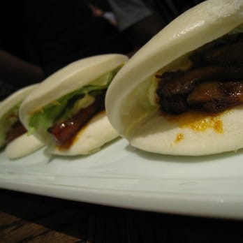 IPPUDO NY - four little pork buns sitting in a row - Ramen Near Me - New York, New York